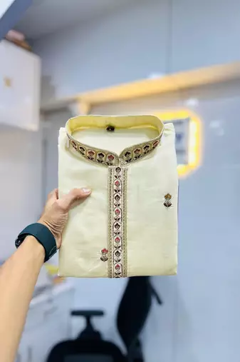 Exquisite light yellow roman shimmer kurta with multi colour embroidery work