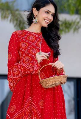 red bandhani print lace work anarkali with pant and dupatta set 4