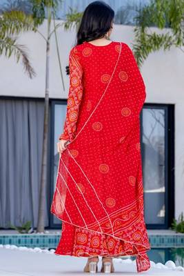 red bandhani print lace work anarkali with pant and dupatta set 5
