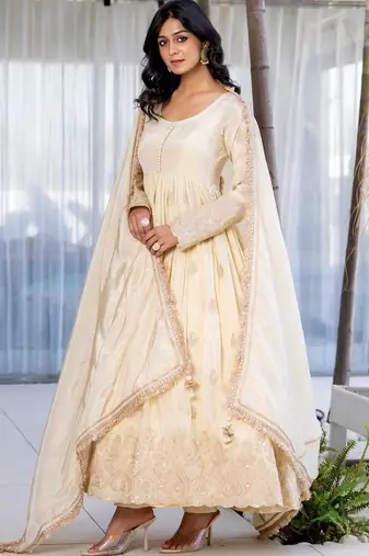 Off white anarkali with gloden emboridered tissue anarkali and pant and dupatta