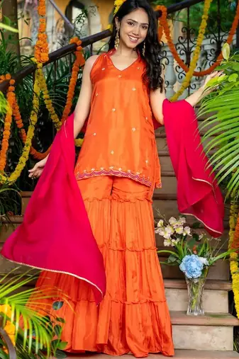 Orange emboridered upada silk kurta and sjarara and pink lace work dupatta