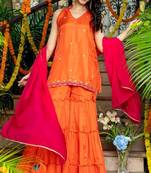 Orange emboridered upada silk kurta and sjarara and pink lace work dupatta