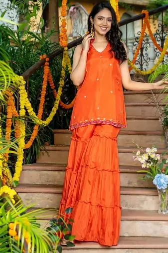 orange uppada silk kurta with sharara and pink dupatta