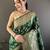 dark_green banarasi soft lichi silk blend dark green floral and zari pattern saree with unstitched blouse