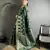 green soft banarasi silk blend green jacquard weaving saree with unstitched blouse