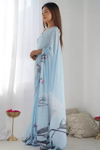 sky blue chinon silk blend print work with mirror work border designer saree