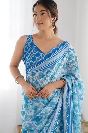 sky blue chinon silk blend print work with mirror work border designer saree