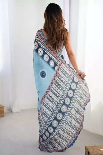sky blue chinon silk blend print work with mirror work border designer saree