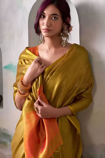 musturd solid tissue art silk blend tassels pallu saree