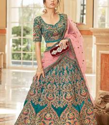 Alluring Teal Blue Thread Zari Dori And Sequins Embroidered Velvet Bridal Wear Lehenga Choli For Women