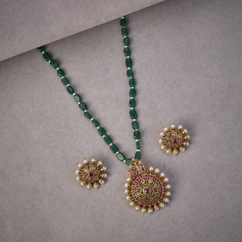 Garnet glow ensemble mehendi plated locket set with earrings