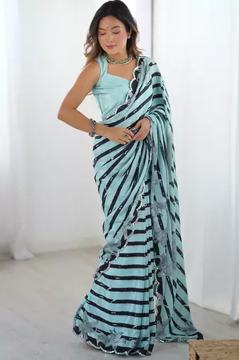 sky blue chinon silk blend print work with mirror work border designer saree