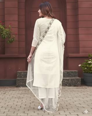 Off white rayon slub embroidered festive wear salwar kameez 2