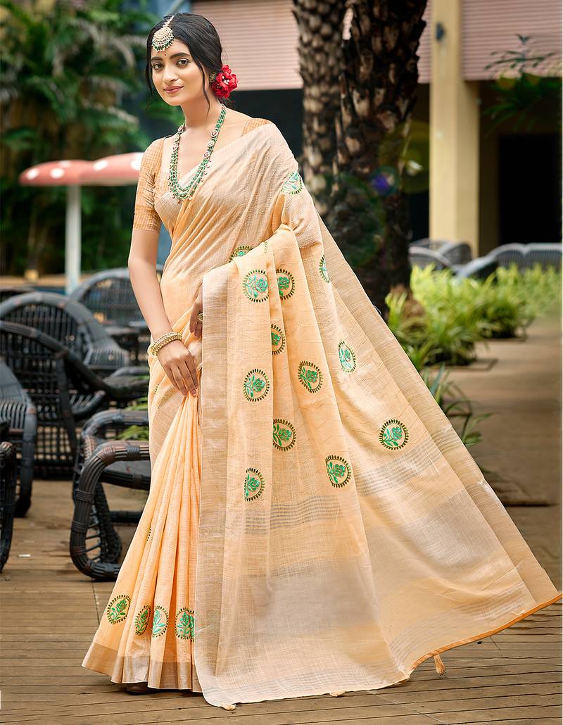 peach color linen fabric woven designer saree with floral embroidered work