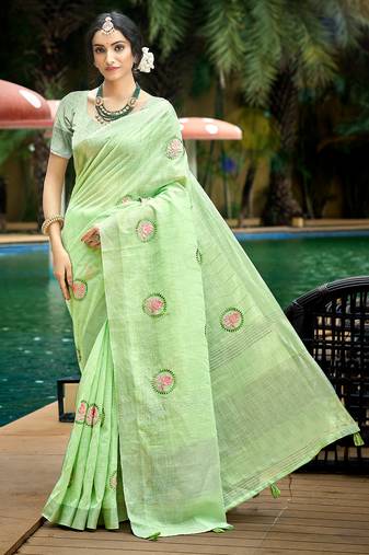 green color linen fabric woven designer saree with floral embroidered work