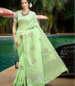 green color linen fabric woven designer saree with floral embroidered work