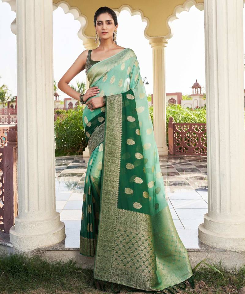 green color georgette fabric heavy wevon designer work  graceful saree