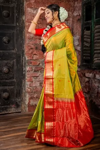 green woven faux kanjivaram silk blend zari work all seasons sarees