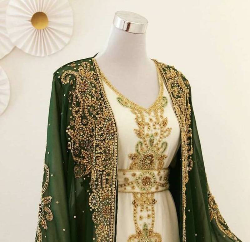 Green georgette kaftan gown with gold zari work