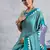 Turquoise printed satin saree with blouse piece