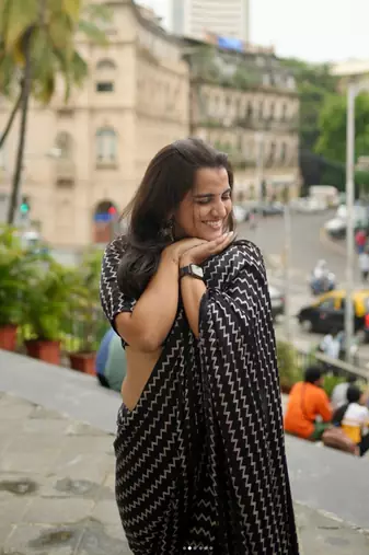 Black printed satin saree with blouse piece