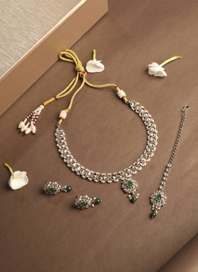 Flower and oval shape green kundan stone gold plated choker necklace set with maang tikka for women