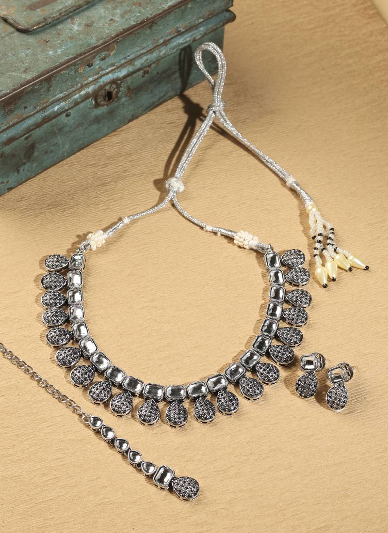 Oval shape silver kundan stone gold plated brass choker necklace set with maang tikka for women