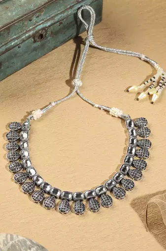 Oval shape silver kundan stone gold plated brass choker necklace set with maang tikka for women