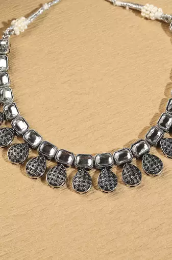 Oval shape silver kundan stone gold plated brass choker necklace set with maang tikka for women