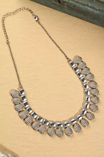 Oval shape white kundan stone gold plated brass choker necklace set with maang tikka for women