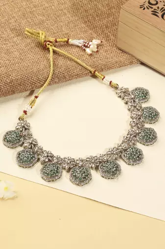 Flower design green kundan stone gold plated brass choker necklace set with maang tikka for women