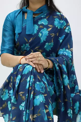 sky blue floral printed georgette saree with lace border	