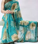 turquoise floral printed georgette saree with lace border