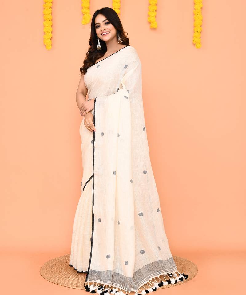 off white linen jamdani saree with tassels & contrast border