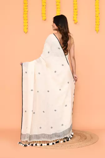 off white linen jamdani saree with tassels & contrast border