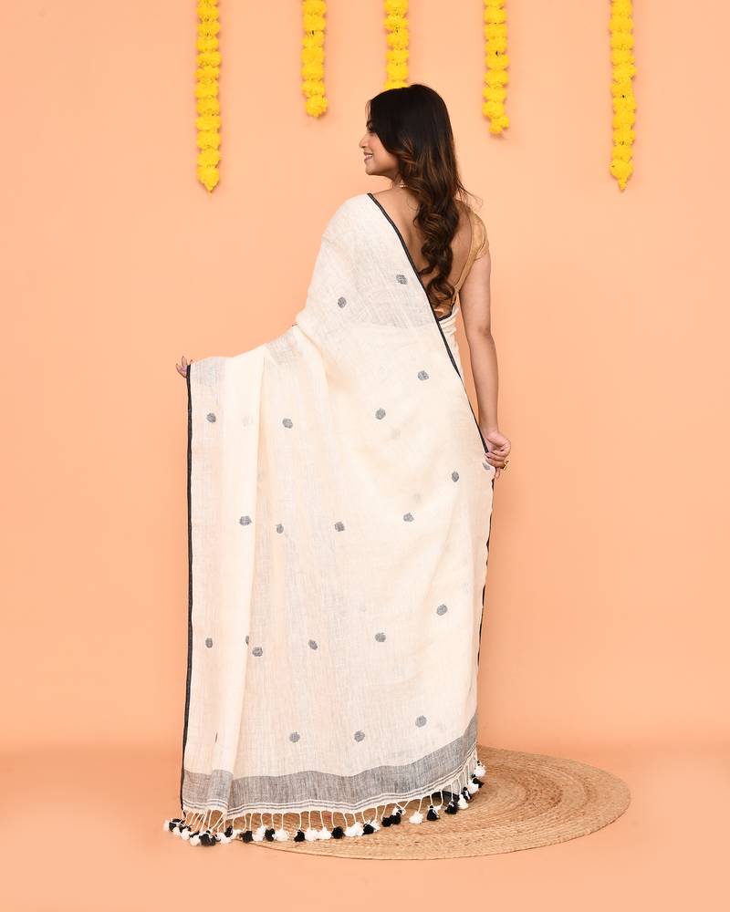 off white linen jamdani saree with tassels & contrast border