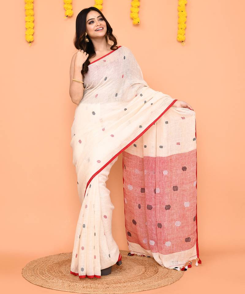 off white linen jamdani saree with red blouse & tassels