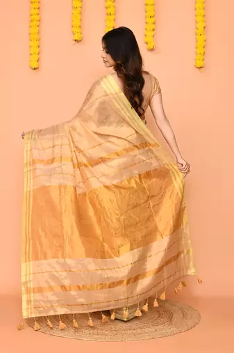 beige cotton tissue saree with zari border