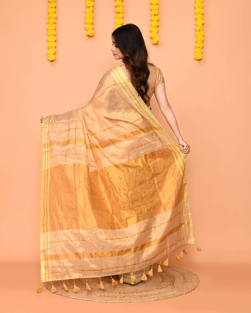 beige cotton tissue saree with zari border