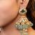 Gold plated kundan green stones jhumka earrings