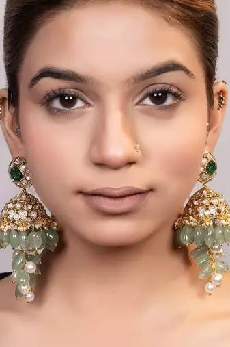 Gold plated kundan green stones jhumka earrings