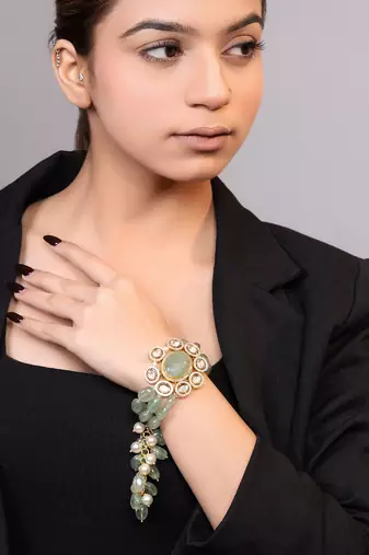 Gold plated kundan green stones bracelet