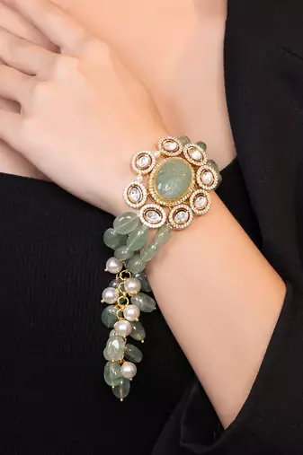 Gold plated kundan green stones bracelet