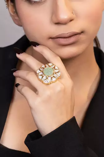 Gold plated kundan green stones ring