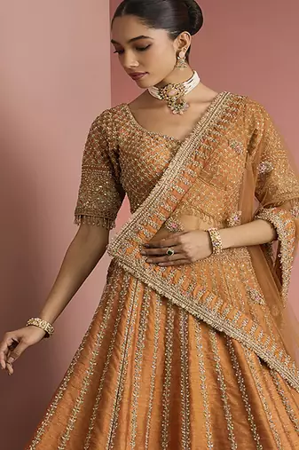 rust orange raw silk lehenga set with blouse and dupatta