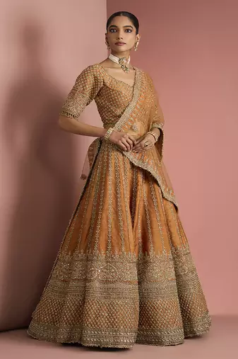 rust orange raw silk lehenga set with blouse and dupatta