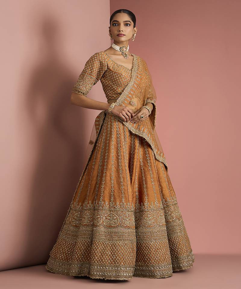 rust orange raw silk lehenga set with blouse and dupatta