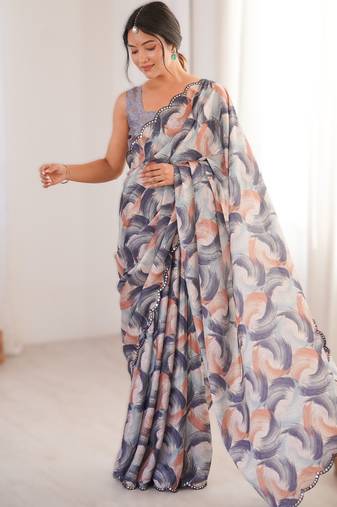 Pruple heavy chinon printed saree with mirror work border