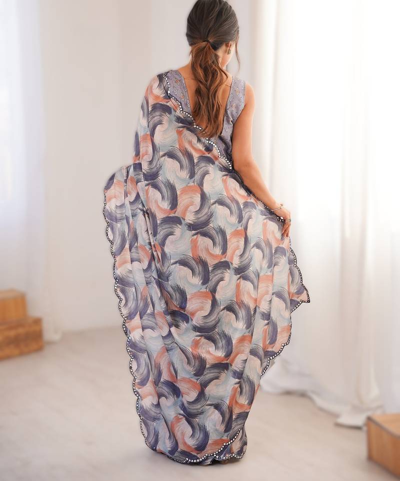 Pruple heavy chinon printed saree with mirror work border