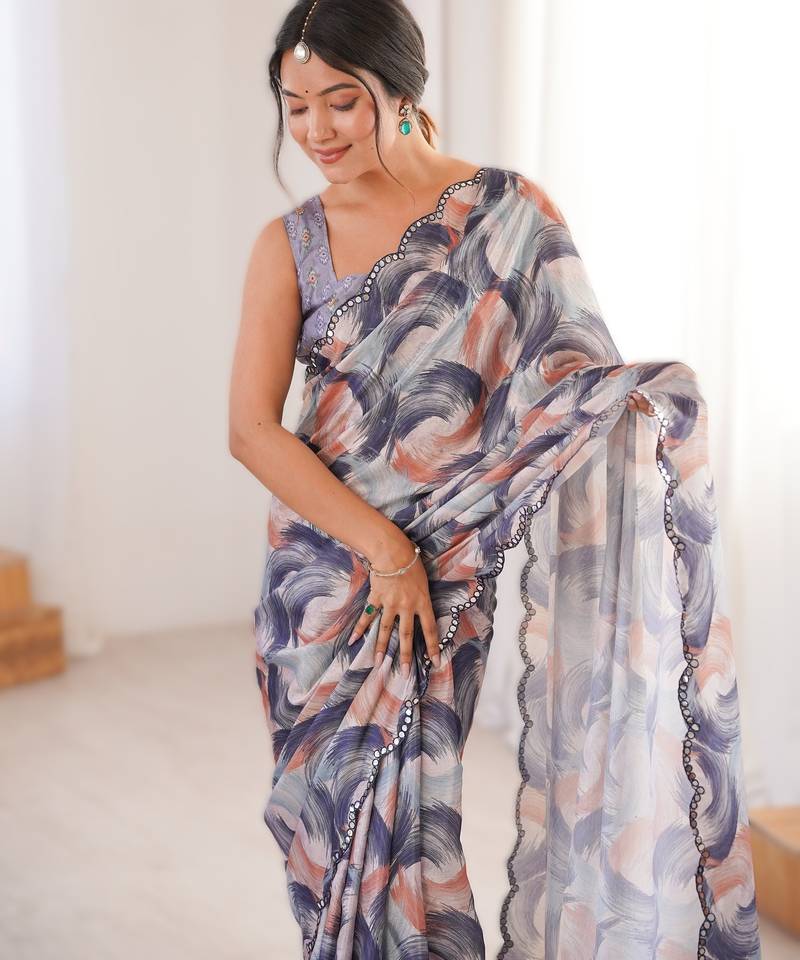 Pruple heavy chinon printed saree with mirror work border